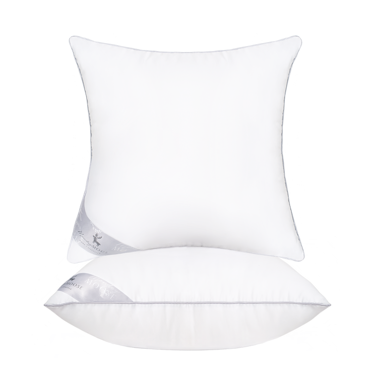 Two white pillows with a brand logo on a white background