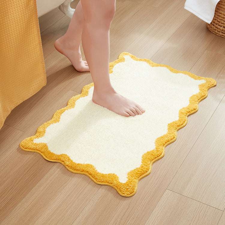 bath mat yellow white scalloped wavy edge