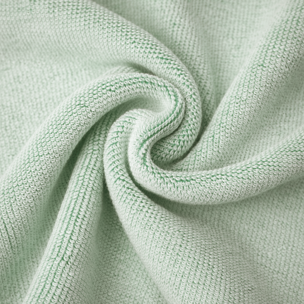 Close-up of light green knitted fabric