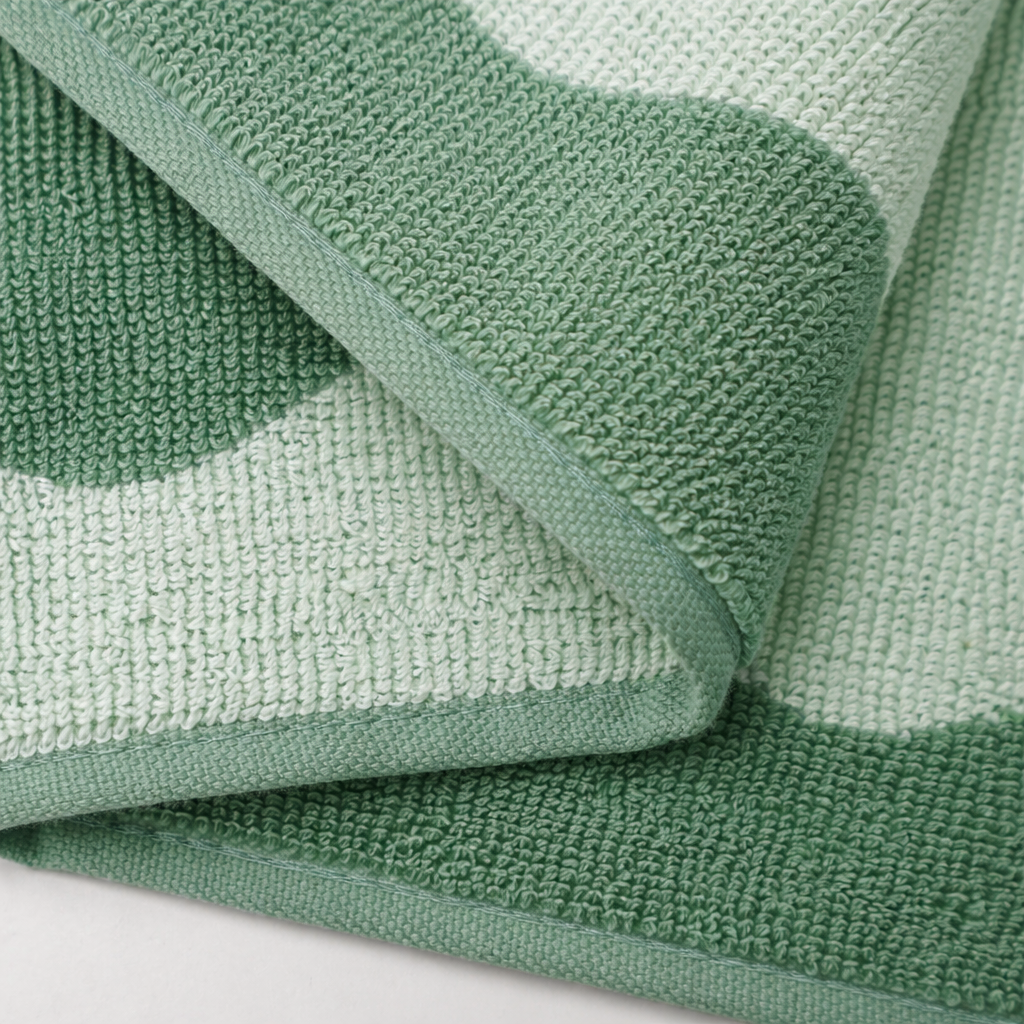 Close-up of a green and white striped towel