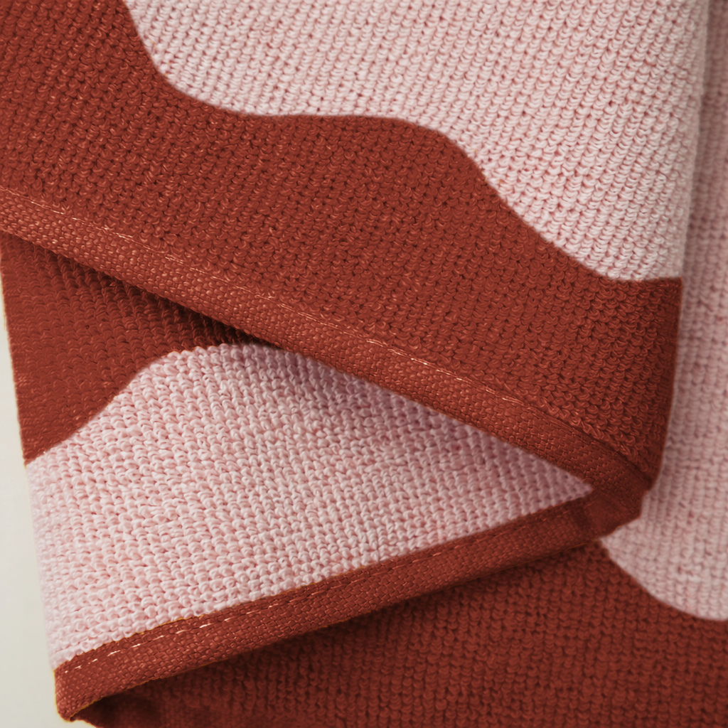 Close-up of a knitted fabric with red and pink pattern