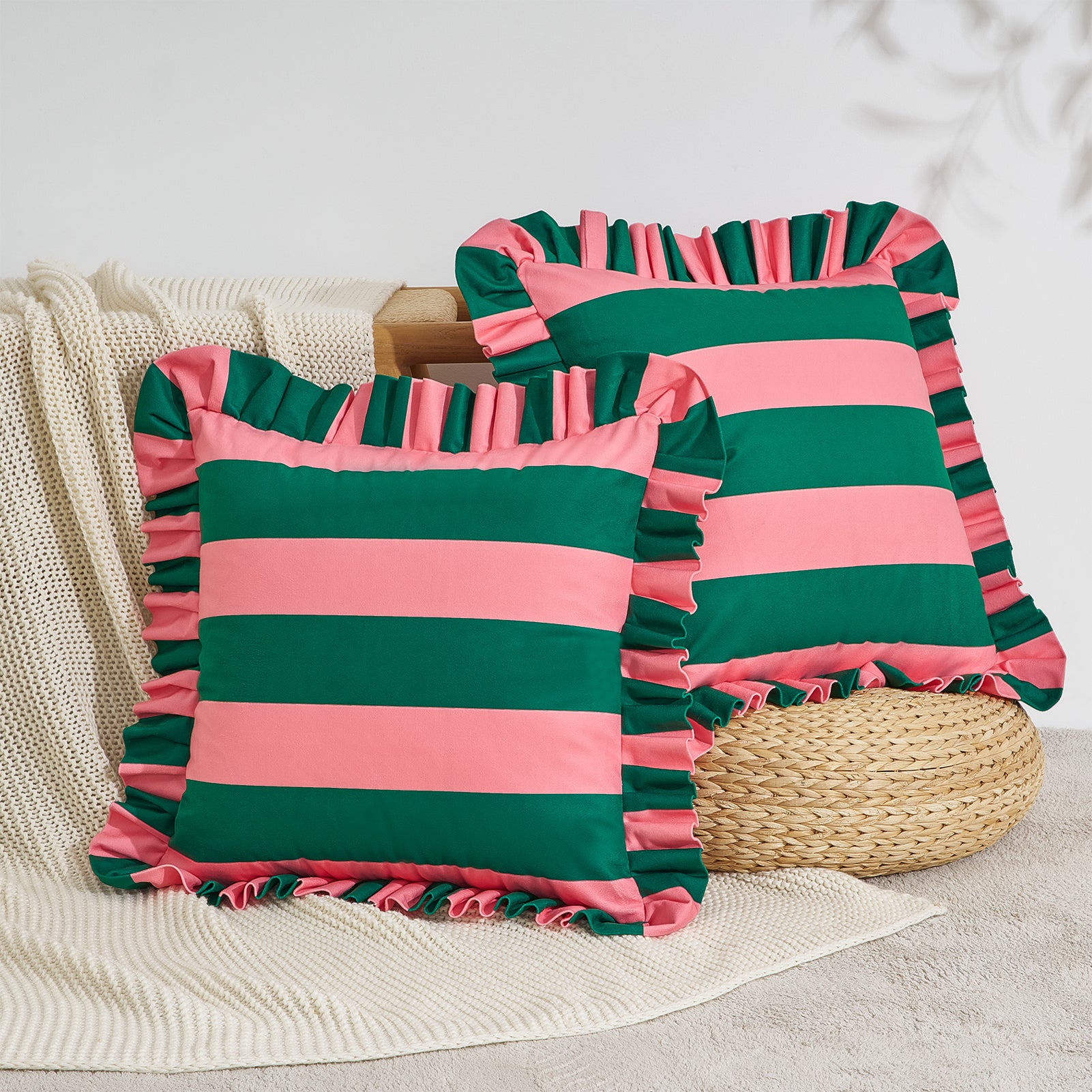 Two striped pillows with ruffled edges on a neutral background