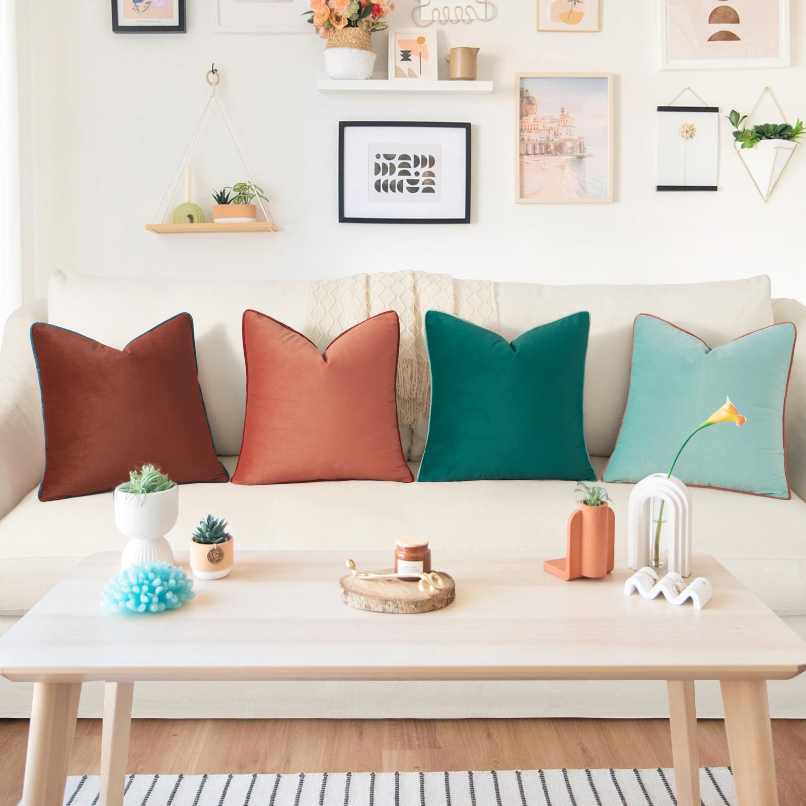 Colorful pillows on a sofa with a coffee table in a living room setting.