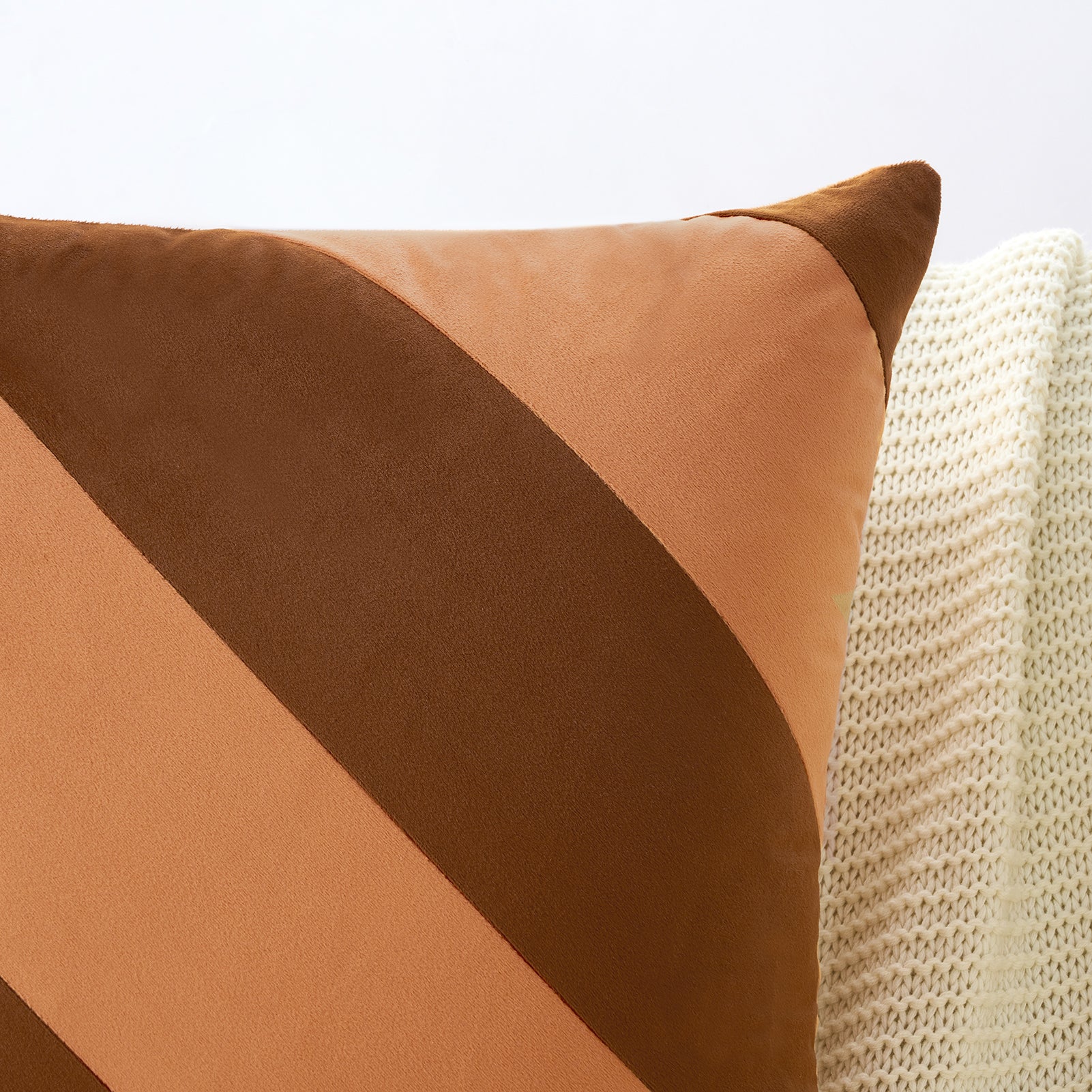 Brown and beige pillow on a textured surface