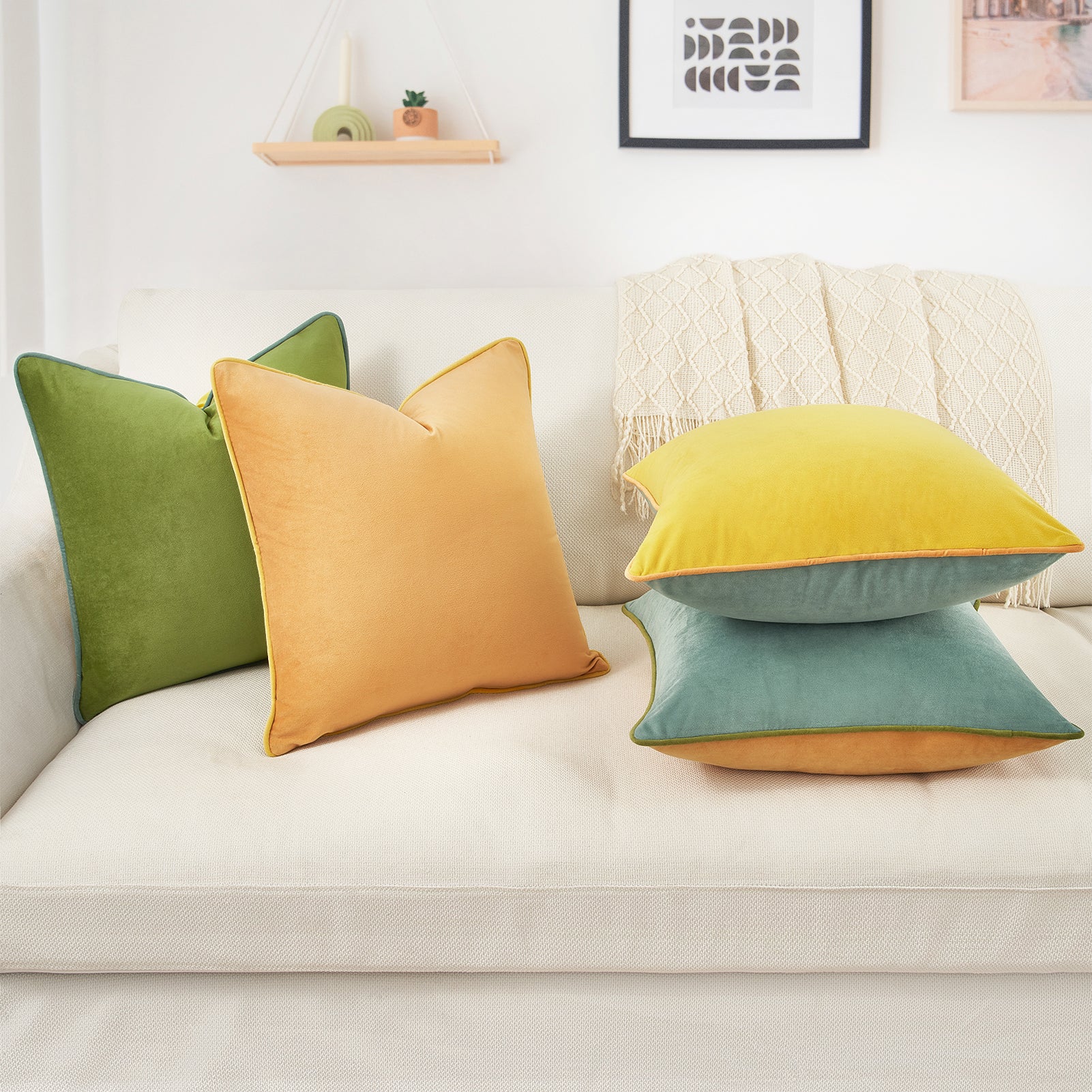 Colorful pillows on a white sofa with a neutral background