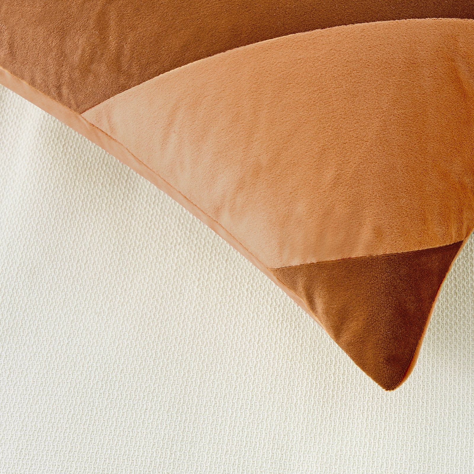Brown velvet pillow on a white background