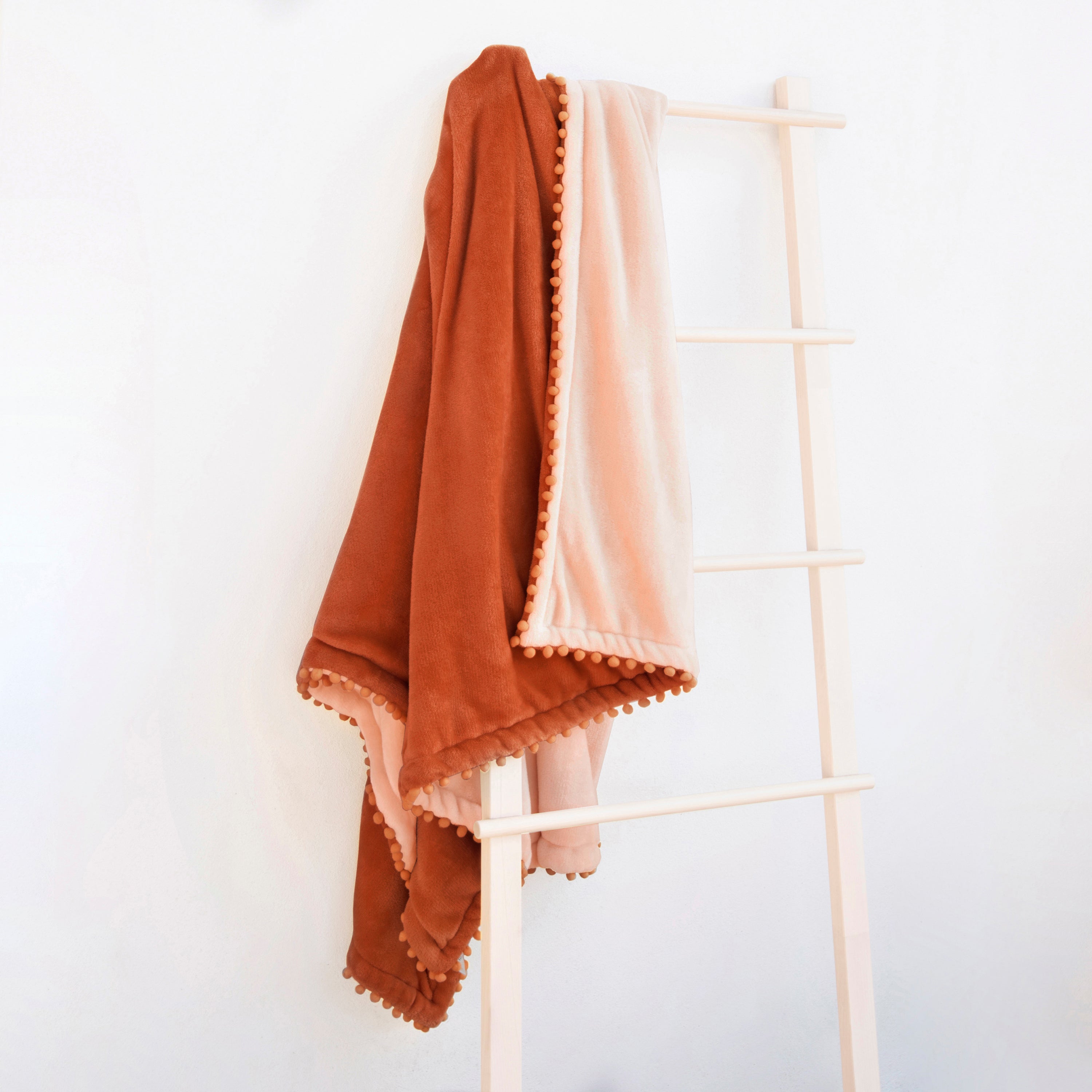 decorative throw blanket pom pom fringe edge reversible design burnt orange light orange
