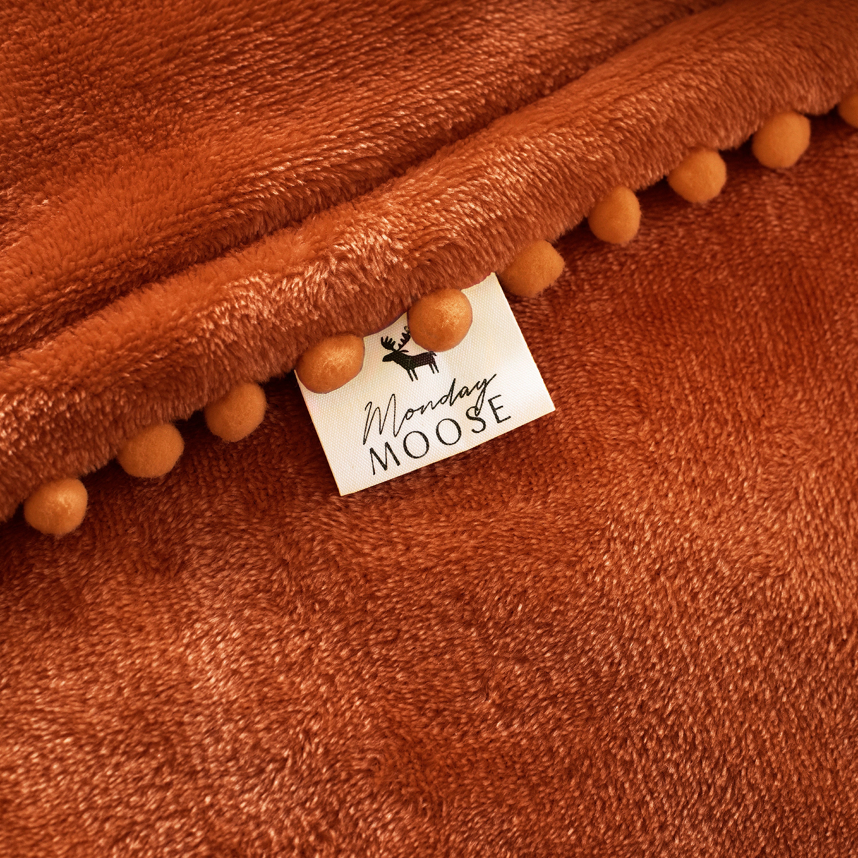decorative throw blanket pom pom fringe edge reversible design burnt orange light orange