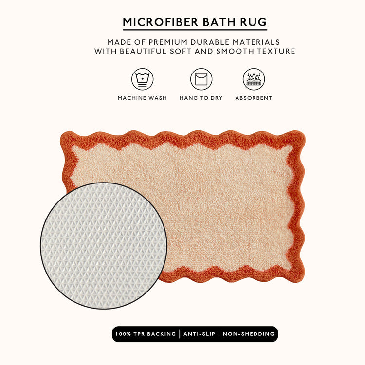 Microfiber bath rug with red border and beige center on a white background, featuring text about material and care.