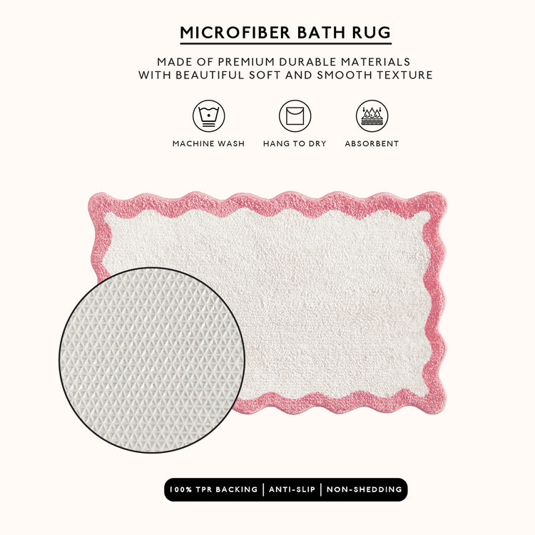 Microfiber bath rug with pink border on a white background, featuring text and icons about material and care.